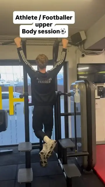 A member doing pull-ups in an athlete upper body session